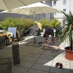 Spraypainting the boxes with stencils